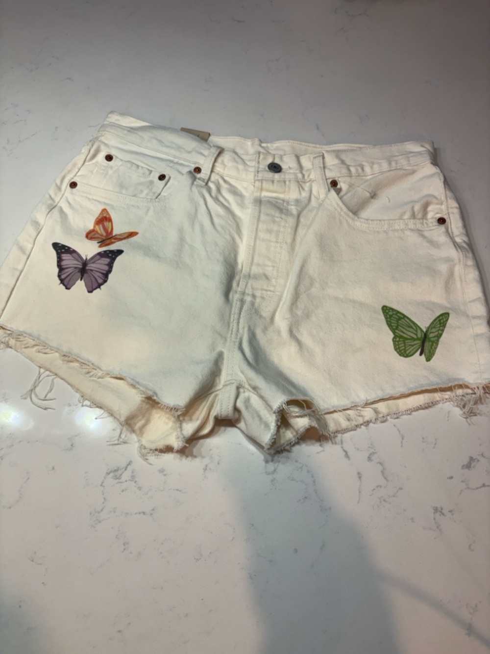 Levi's White Denim Shorts with Colorful Butterfly Accents